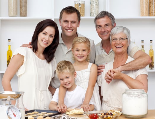 Grandparents, parents and children baking in the kitchen