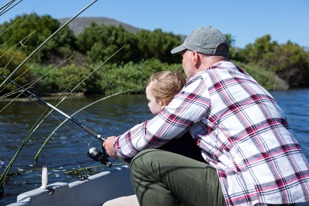Vetran fishing with his son in the boat