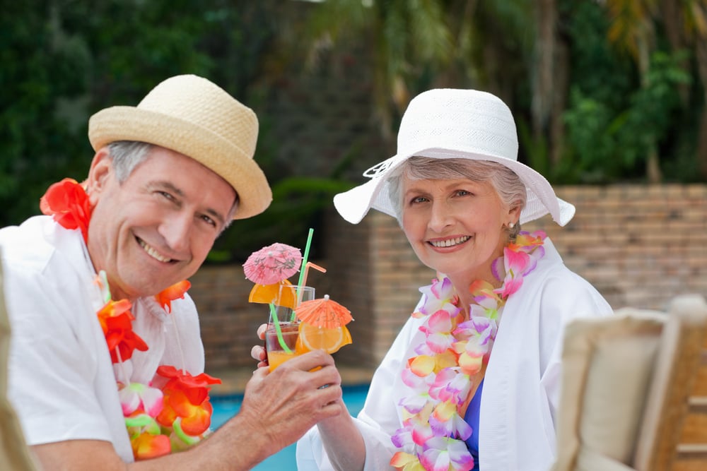 Happy senior couple staying hydrated in the Summer 