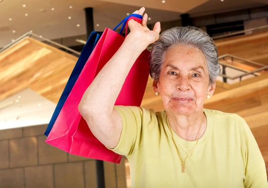 beautiful senior doing some shopping in a shopping mall